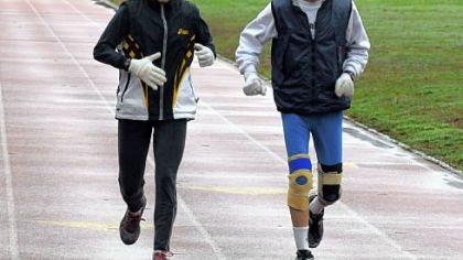 Tammy and Don Slusser preparing for the Pittsburgh Marathon. He has run in all 21 marathons, while she has run in some (winning two); he proposed to her at the finish line of the 1986 race.