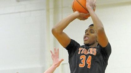 Beaver Falls High School junior Sheldon Jeter puts up a 3-point attempt in a non-section game against rival  Blackhawk earlier this month. Jeter missed the first 11 game with a broken bone in his left hand.