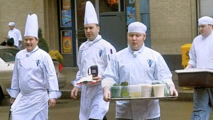 In a familiar sight Downtown, chefs and students from Le Cordon Bleu Institute of Culinary Arts cross Liberty Avenue between their facilities in the Clark Building and those at 808 Liberty.