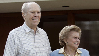 In this April 23, 2006, photo former President Gerald Ford and former first lady Betty Ford smile from the front of their home in Rancho Mirage, Calif.
