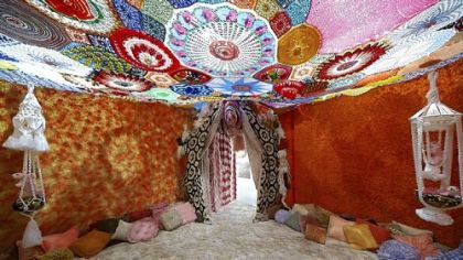 Allyson Mitchell's room-sized installation "Hungry Purse" appears in the exhibition "DIY: A Revolution in Handicrafts" at the Society for Contemporary Craft.