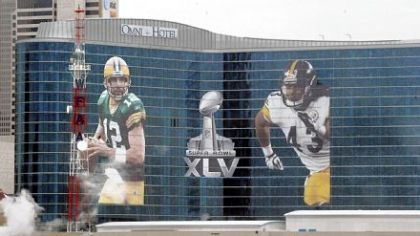 The Omni Hotel in Dallas displays giant posters of Super Bowl XLV opponents Aaron Rodgers of the Packers and Troy Polamalu of the Steelers. The two NFL stars will face off at 6:30 p.m. today at Cowboys Stadium.