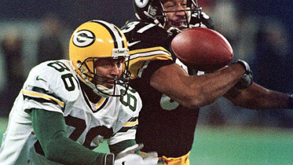 Former Steelers cornerback Carnell Lake deflects a pass intended for the Green Bay Packers' Antonio Freeman in 1998.