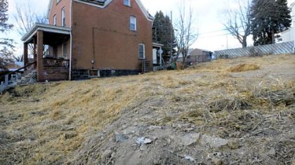 A straw-covered lot is all that remains of a home that was mistakenly demolished along with a scheduled demolition in the 3200 block of Motor Street in Sheraden.