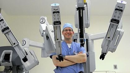 Arthur Thomas, a urologist at St. Clair Hospital, with the $1.8 million robot. The hospital has acquired the robotic device for minimally invasive surgeries.