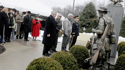 Attendees pause to remember the 13 soldiers from the 14th Quartermaster Detachment killed in the 1991 SCUD missile attack in Iraq.