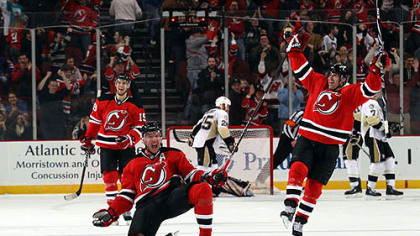 Devils forward Ilya Kovalchuk celebrates his overtime goal against the  Penguins with teammates, Travis Zajac and Brian Rolston at  at the Prudential Center in Newark, N.J. Friday.