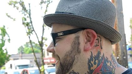 Keith Fuller shows off his ink.