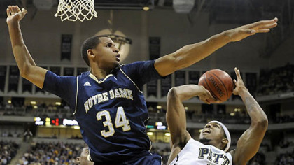 Notre Dame's Carleton Scott cuts off Gilbert Brown going to the basket Monday night at the Petersen Events Center.