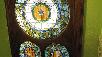 Detail of three stained-glass windows in the landing of the Wigman House in Carrick.