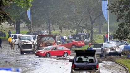 Cars lie strewn about on Washington Boulevard near Highland Park after storms brought heavy rains and street flooding.