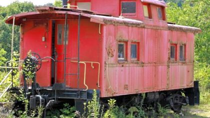 A rusting red caboose adds to the ambiance at the flea market.