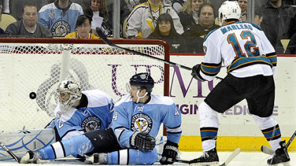 Sharks forward Patrick Marleau scores in overtime on Penguins goaltender Marc-Andre Fleury and defenseman Zbynek Michalek during Wednesday's game at Consol Energy Center.