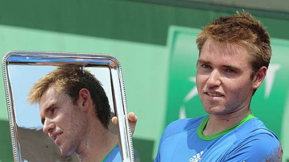 Plum native Bjorn Fratangelo holds the trophy after winning the boy's singles final match in the French Open Sunday at the Roland Garros Stadium in Paris.