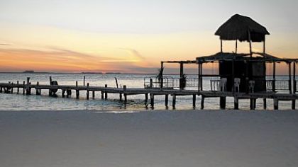The sun sets over Playa Norte on the northern end of Isla Mujeres, a sleepy island off the coast of Cancun, Mexico.