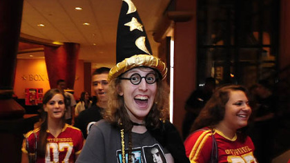 Carly Marnik, 19, of Peters arrives dressed as Harry Potter for the 12:01 screening of the final film of the popular series at AMC Loews Theater at the Waterfront. "I've been to every midnight opening," she said.