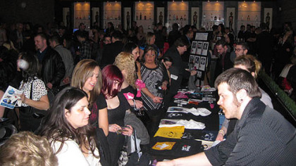 Guests buy T-shirts and other items bearing images of pit bulls at Hello Bully's 3rd annual Lovers Not Fighters Gala at the Zen Social Club.