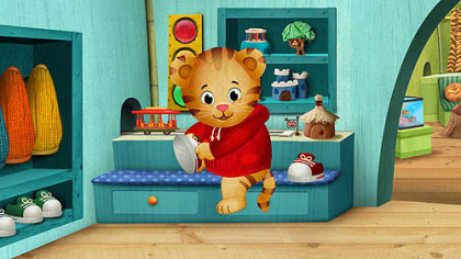 Daniel Tiger changes into sneakers, a nod to Fred Rogers on "Mister Rogers' Neighborhood," in the new series "Daniel Tiger's Neighborhood," set to debut on PBS stations nationwide in the fall of 2012.