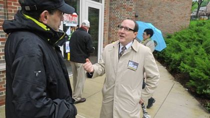 Marty Childs of Squirrel Hill listens to Councilman Doug Shields as he campaigns at the Colfax Elementary School. Hugh McGough defeated him for the district judge seat in the city's East End.