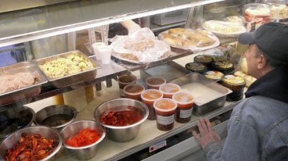 Bob Rodrigues, of Forest Hills, checks out the case at Groceria Italiana in Bloomfield.