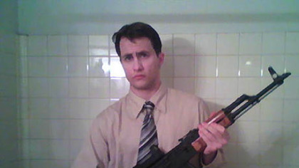 Richard Poplawski poses with an assault rifle in this photo, which was entered as evidence. Poplawski uploaded this photo to his laptop computer in November 2008.