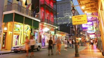 Dusk falls over Bourbon Street in the French Quarter of New Orleans.