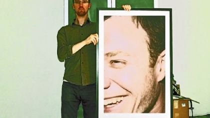 Musician David Bernabo holding photo of Will Dyar of Host Skull