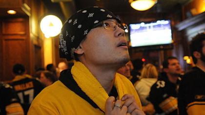 Samuel Siah, of the North Hills, follows the game.