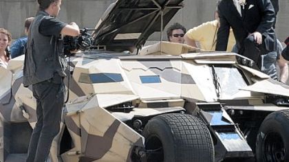 Rich Walsh gets the chance to climb into the cockpit of Batman's vehicle. Michele Walsh's wedding dress prevented her from doing the same.