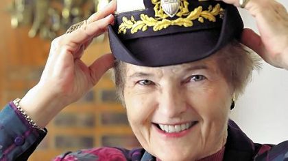 Beth Coye tries on her bucket hat, part of the uniform she wore as a U.S. Navy commander before retiring in 1980. Ms. Coye is a member of the Forum on Military Chaplaincy, a gay rights group advising the Pentagon on the impending repeal of its ban on gays.