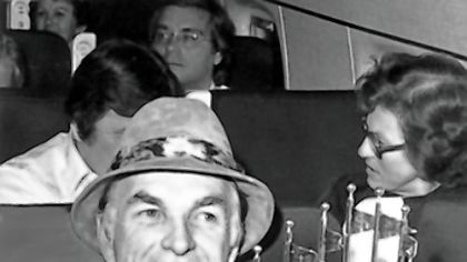 Chuck Tanner savors the 1979 World Series championship trophy on his ride home.