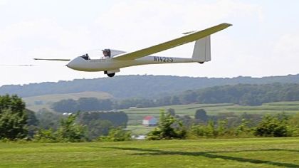 Erich Ochs, a member of the Pittsburgh Soaring Club, takes off with the help of a tow plane at Bandel Airport in North Bethlehem.