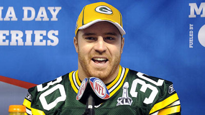 Packers fullback John Kuhn talks to reporters during media day at Cowboys Stadium in Dallas Tuesday.