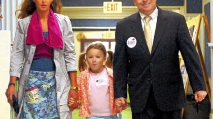 Democratic candidate for Allegheny County Executive Mark Patrick Flaherty is accompanied by his wife, Anne, and daughter, Deirdre, as he arrives to vote at the Markham Elementary School in Mt. Lebanon Tuesday morning. Rich Fitzgerald of Squirrel Hill gained the Democratic nomination in this week's primary.