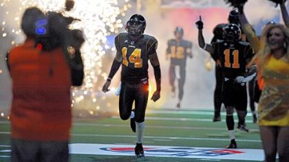 Pittsburgh Power QB Bernard Morris runs onto the field before the opening game in March.