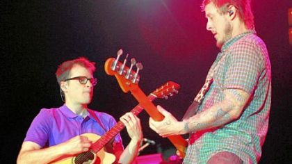 Frontman Rivers Cuomo and bass player Scott G. Shriner play as Weezer performs at Stage AE on the North Shore on May 29.