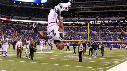 Jets wide receiver Braylon Edwards does a flip in celebration of the Jets' 17-16 win against the Colts during their AFC wild card playoff game at Lucas Oil Stadium Jan. 8, 2011.