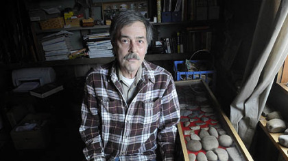 Mike Kotz with his collection of artifacts.