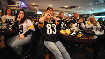 June Hough Repic, of Greenfield, center, covers her eyes while watching with husband Tony and other family members, Lisa Morgavo, Nick Egidlo and Janie Medjimorec at Hough's bar in Greenfield, where Green Bay Packers coach Mike McCarthy was raised.