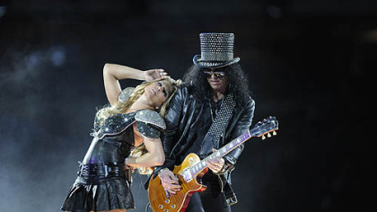 The black-hatted Slash of Guns 'N Roses made a cameo, shown here with Fergie of Black Eyed Peas.