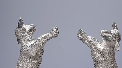 Amy Johnston's silver "Did Dolly Dream of a Bio Mom?" references Dolly, the cloned sheep, atop a double helix.