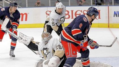 Marc-Andre Fleury blocks a shot on goal by the Rangers' Brandon Prust (8) in the second period Sunday. Fleury had 31 saves.