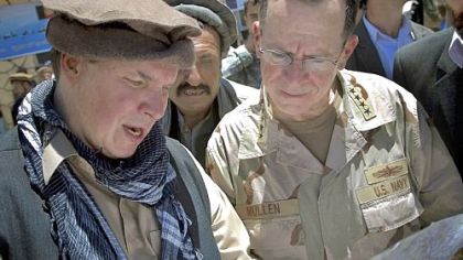 Greg Mortenson shows the locations of future village schools to Adm. Mike Mullen, chairman of the Joint Chiefs of Staff, at the opening of Pushghar Village Girls School 60 miles north of Kabul in Afghanistan.