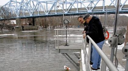 Cecil Griffith, right, maintenance supervisor for the Beaver Falls (Pa.) Municipal Authority, and Jim Riggio, plant manager, watch the bubbler at one of the intake gates on the Beaver River at the authority's water treatment plant Dec. 15. Their water began flunking tests for trihalomethanes regularly last year, around the time that a facility 18 miles upstream became Pennsylvania's dominant gas wastewater treatment plant.
