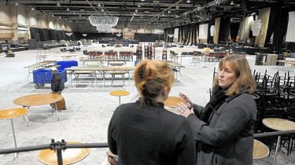 Shelly Tolo, right, on  talks to Wendy McDermott about the transformation of the Farm Show Complex into a ballroom for the Governors Ball as part of the Inaugural events for Tom Corbett, to be sworn in as the new PA governor on Tuesday.