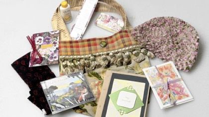Handmade bags from The Satchels of Caring Foundation contain helpful items such as head scarves and coupons for turbans for cancer patients undergoing chemotherapy.