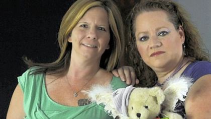 Shawn Betts, left, and Tammy Tobac hold mementos of their stillborn children. The two will be in Harrisburg for the signing of the Missing Angels law.