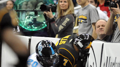 The walls of Arena Football League games are padded, but it's still jarring to be driven into one. Philadelphia's Tanner Varner tackles the Power's Jason Willis in the season opener at Consol Energy Center.