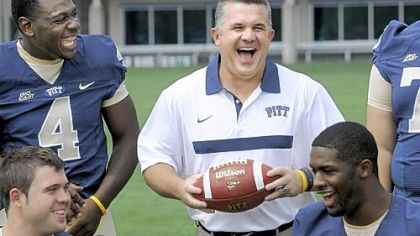 All smiles: Pitt coach Todd Graham shares a laugh with Todd Thomas (4) as the team takes part in media day Monday.