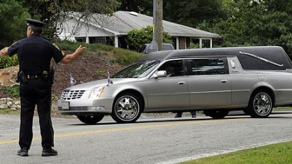 A hearse arrives at Murrysville Community Church for the funeral for flood victims Kimberly, Brenna and Mikaela Griffith.